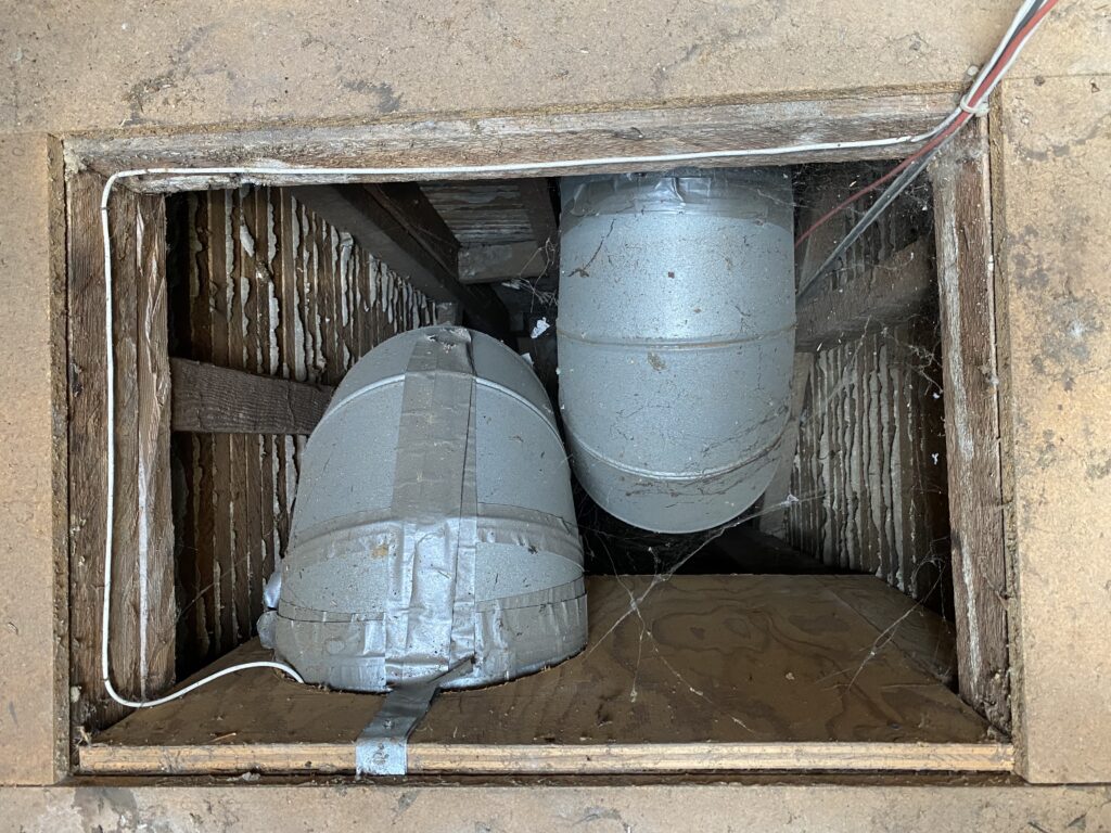 Old gas ducts removed from central chase to save space.