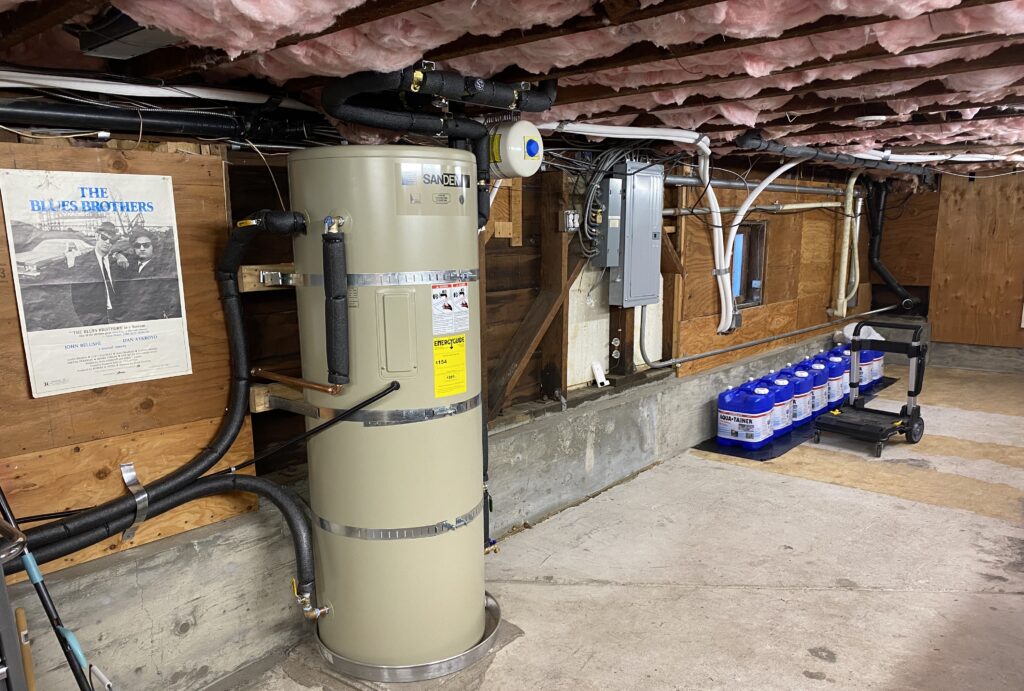 Sanden heat pump hot water heater in new clean basement free of gas furnaces.